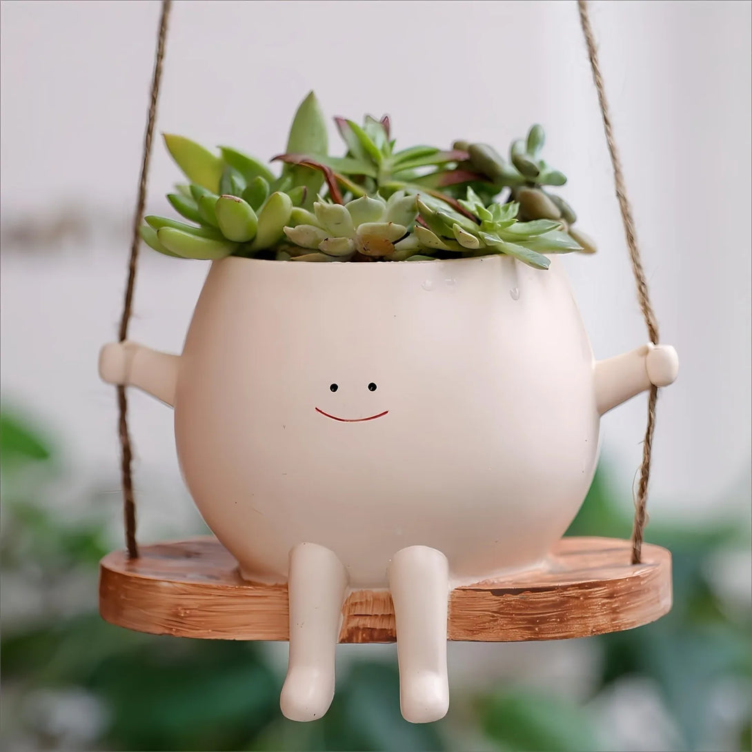 Pot de fleurs en résine : ce pot de fleurs suspendu avec balançoire est un objet de décoration - CHiCLiKi