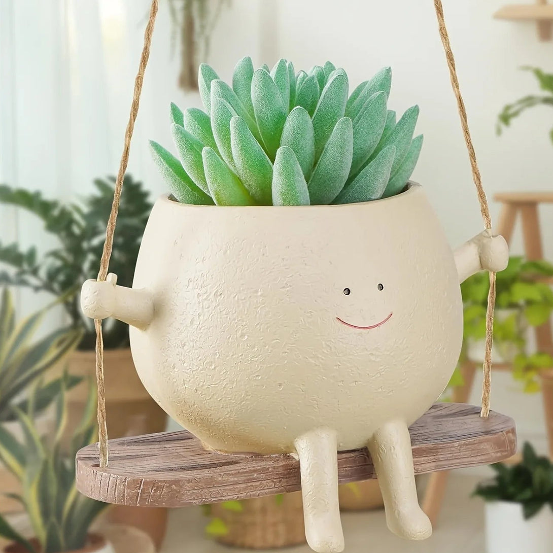 Pot de fleurs en résine : ce pot de fleurs suspendu avec balançoire est un objet de décoration - CHiCLiKi