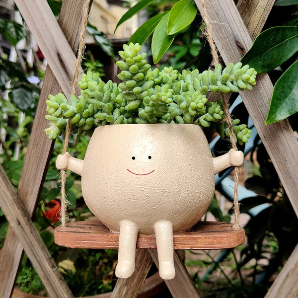 Pot de fleurs en résine : ce pot de fleurs suspendu avec balançoire est un objet de décoration - CHiCLiKi